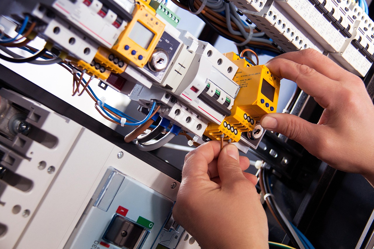 Electrician working on electrical panel